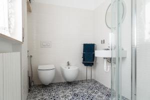 a bathroom with a toilet and a sink at Ghe Sem Morazzone B&B in Gazzada
