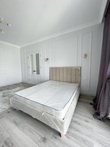 Säng eller sängar i ett rum på Premium Apartments Esil Riverside