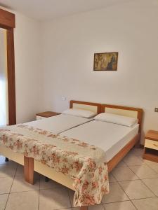 Postel nebo postele na pokoji v ubytování Casa Comisso