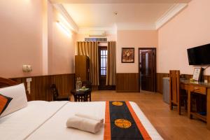 Postel nebo postele na pokoji v ubytování Hoa My II Hotel