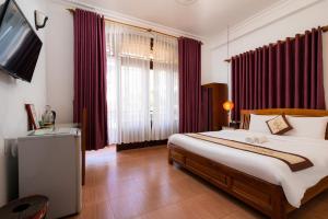 Postel nebo postele na pokoji v ubytování Hoa My II Hotel