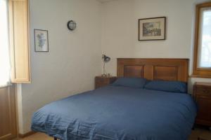 A bed or beds in a room at La Casa Altrui- Camere e Zona relax con Giardino