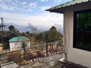 a view from the side of a house with a balcony at Flutter Hotels & Resorts in Lansdowne