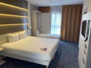 Voodi või voodid majutusasutuse Ibis Styles Nivelles toas