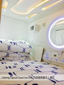 A bed or beds in a room at Harbour Hella Inn