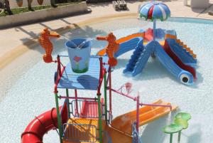 a water slide in a swimming pool at Wyndham La Vita Rawai Phuket in Rawai Beach