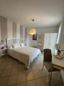 Posteľ alebo postele v izbe v ubytovaní B&B al Doremi