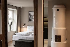 Cama ou camas em um quarto em HOTEL & SPA Goldene Rose
