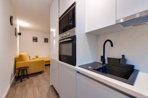 Kuchyň nebo kuchyňský kout v ubytování MINMAR Apartments