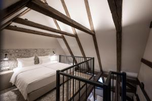 Cama ou camas em um quarto em HOTEL & SPA Goldene Rose