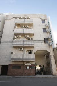 a large building with a large window at Sankei City Hotel Hachioji in Hachioji