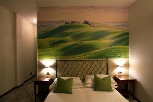 Voodi või voodid majutusasutuse Hotel Le Colline toas