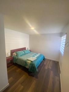 Ένα ή περισσότερα κρεβάτια σε δωμάτιο στο Condominio Rocura +6 φωτογραφίες