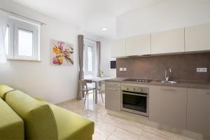 Kuchyň nebo kuchyňský kout v ubytování Apartments Villa Nina
