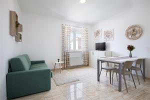 TV a/nebo společenská místnost v ubytování Apartments Villa Nina