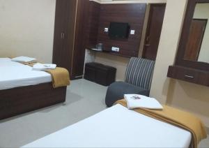 Postel nebo postele na pokoji v ubytování PLAZA GUEST HOUSE