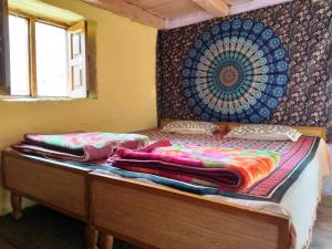 Llit o llits en una habitació de Buransh Homestay