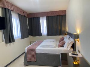 Postel nebo postele na pokoji v ubytování Hotel Estée