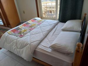A bed or beds in a room at Nile House