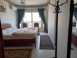 A bed or beds in a room at Nile House