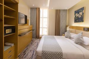 Postel nebo postele na pokoji v ubytování Qasr Al Sahab Hotel Makkah