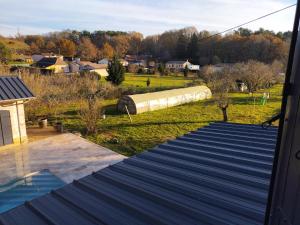 a view from the roof of a house with a train at A la Gare in Saint-Nexans