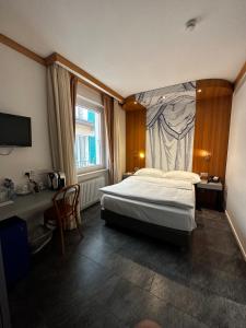 Postelja oz. postelje v sobi nastanitve Albergo Carcani by Ketty & Tommy