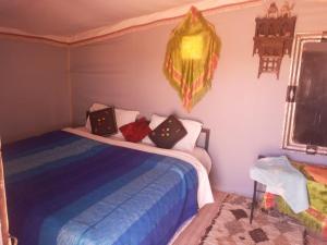 a bedroom with two beds in a room at Couleur du désert in Mhamid +13 photos