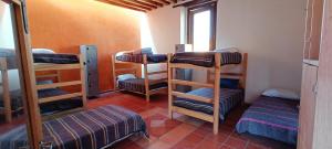 Ένα ή περισσότερα κρεβάτια σε δωμάτιο στο Hostal del Desterrado