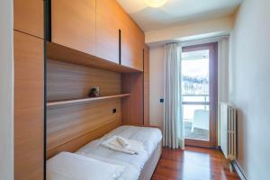 Posteľ alebo postele v izbe v ubytovaní Terrazza su Sestriere Lux