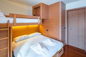 Posteľ alebo postele v izbe v ubytovaní Terrazza su Sestriere Lux