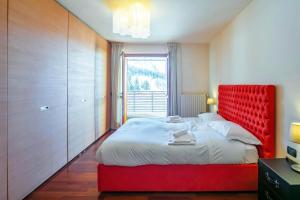 Posteľ alebo postele v izbe v ubytovaní Terrazza su Sestriere Lux