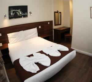 En eller flere senger på et rom på Ascot Hyde Park Hotel