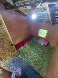 an overhead view of a small room with a green floor at Bacnotan, La Union Private Resort - Teresa Kazza Resort in Bacnotan