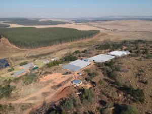 an aerial view of a farm on a hill at Aloe Inn Guest Farm in Piet Retief