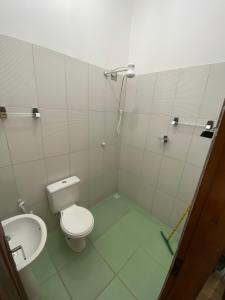 a bathroom with a toilet and a sink at Pousada Trilha das Dunas in Jericoacoara +25 photos