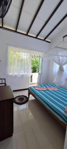 Voodi või voodid majutusasutuse Wimala B&B toas