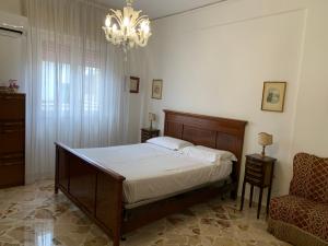 מיטה או מיטות בחדר ב-La Baronessa
