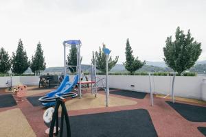 a playground on the roof of a house at Mini House Gombak 2BR 5pax Ayuman Suites in Kuala Lumpur