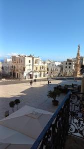 a view of a city from a balcony at Il Pregio in Ostuni