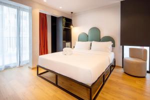 Ein Bett oder Betten in einem Zimmer der Unterkunft PAREA Athens