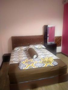 Postel nebo postele na pokoji v ubytování Beaufort Paguyut Homestay