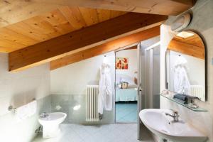 a bathroom with a sink and a toilet at Hotel Caprice - in centro a Riccione in Riccione