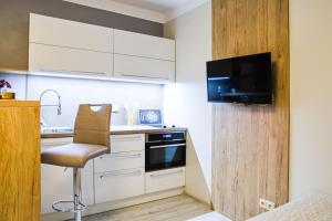 Kuchyň nebo kuchyňský kout v ubytování Apartmány a Wellness VMAL
