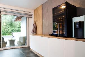 Kuchyň nebo kuchyňský kout v ubytování Apartmány a Wellness VMAL