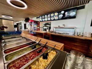 a fast food restaurant with many different types of food at Hotel Prichovice in Kořenov