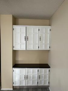 a room with white cabinets on the wall at MT Pleasant NW 2 bedrooms 502 in Calgary