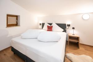 Rúm í herbergi á Kuckuck Hinterthal - Appartements