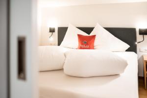 Rúm í herbergi á Kuckuck Hinterthal - Appartements