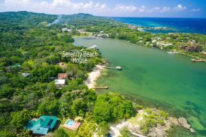 an aerial view of a small island in a body of water at Serenity Beach Home in West End